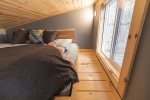 The lofted queen bed is extra cozy